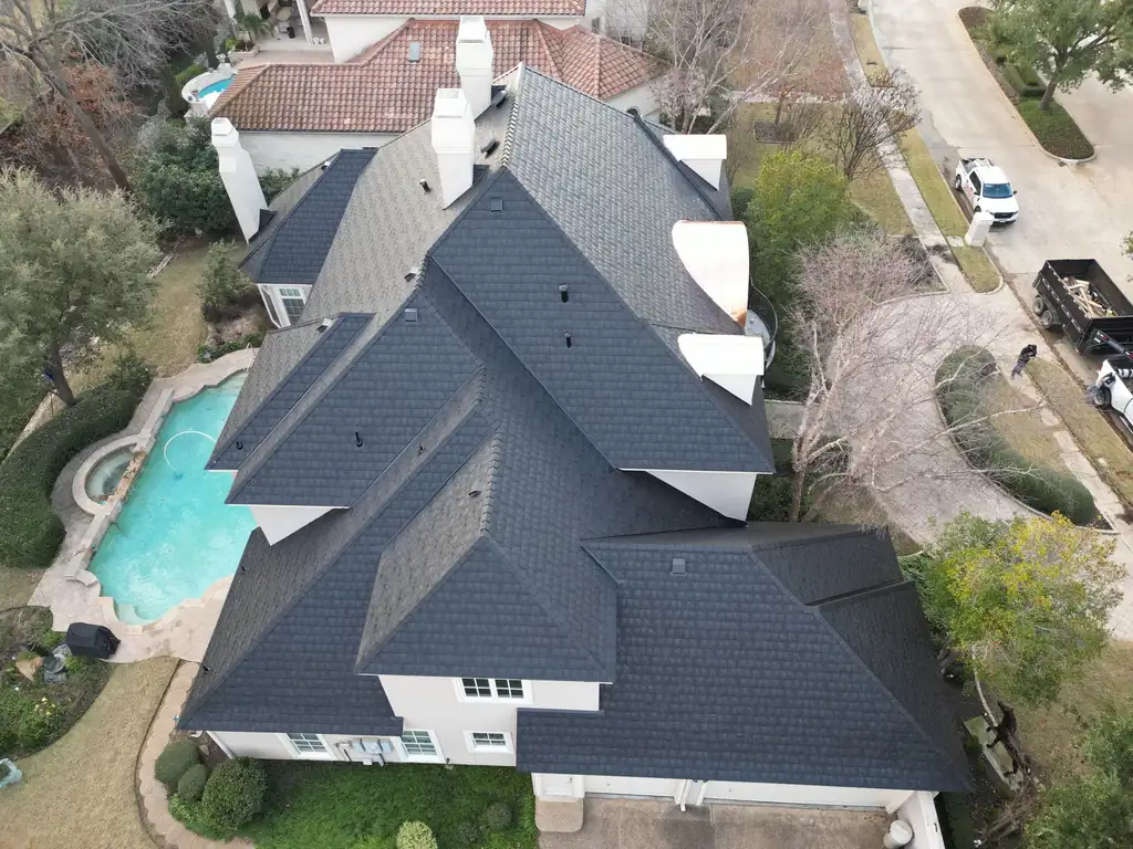 Aerial view of a new roof installed by Dimensional Pro Construction