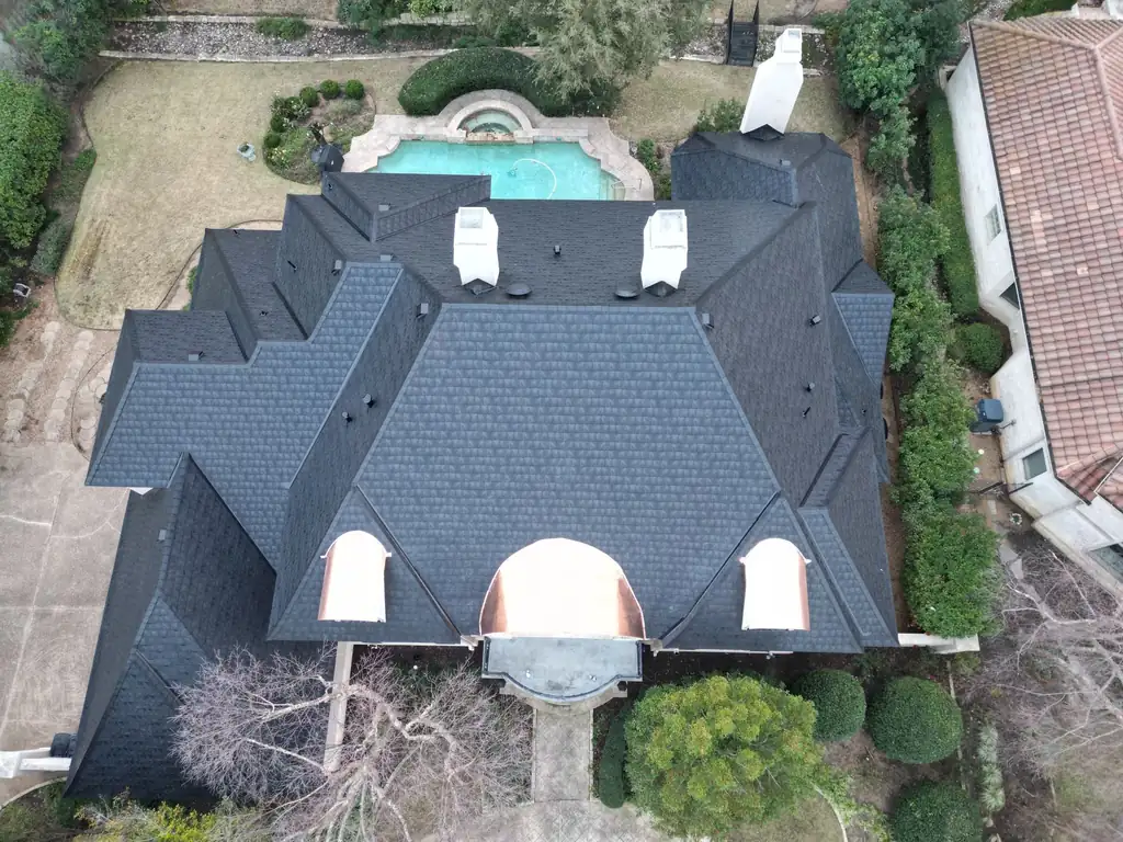 Aerial view of a new roof installed by Dimensional Pro Construction