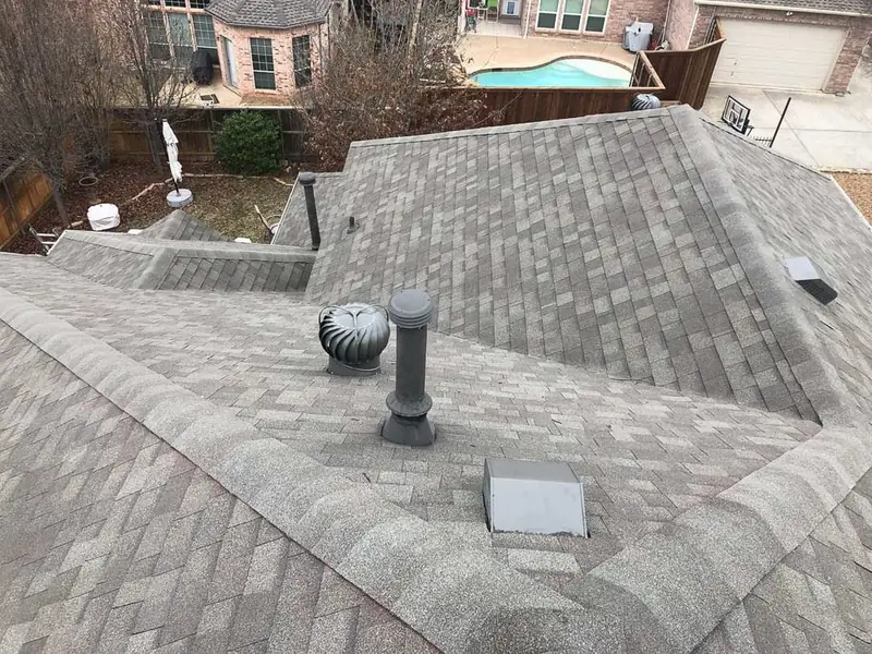 Close-up of new shingles installed by Dimensional Pro Construction