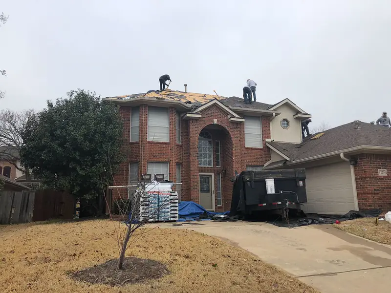 Dimensional Pro Construction crew working on a roof replacement