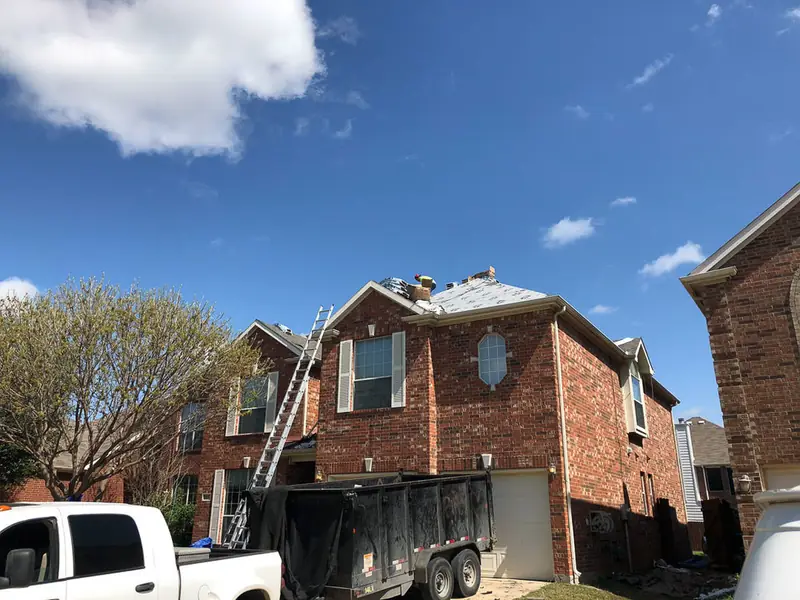 Dimensional Pro Construction crew working on a roof replacement
