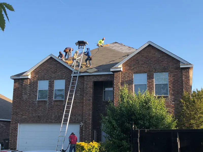 Dimensional Pro Construction crew working on a roof replacement