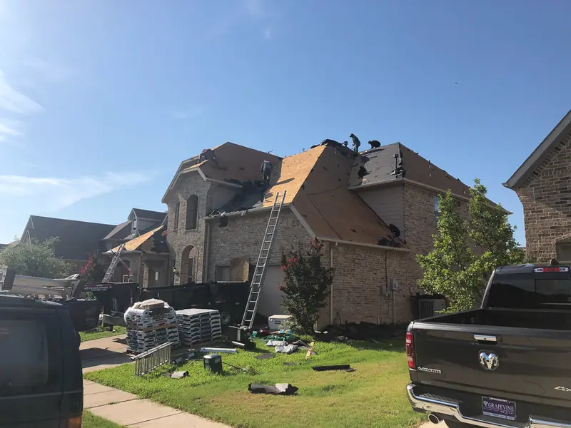 Dimensional Pro Construction crew working on a roof replacement
