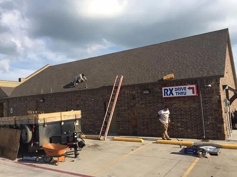 Dimensional Pro Construction crew working on a roof replacement