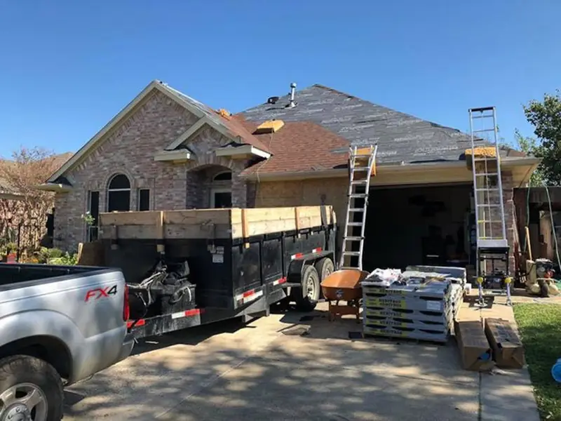 Dimensional Pro Construction crew working on a roof replacement