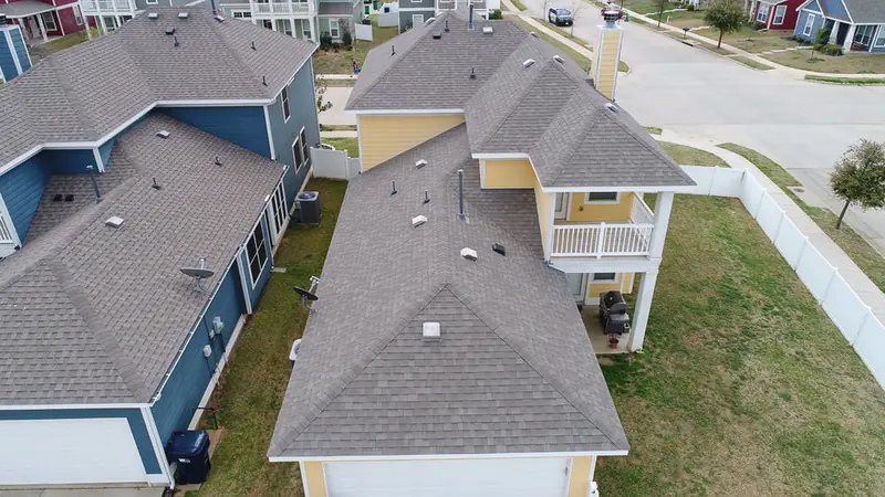 Aerial view of a new roof installed by Dimensional Pro Construction