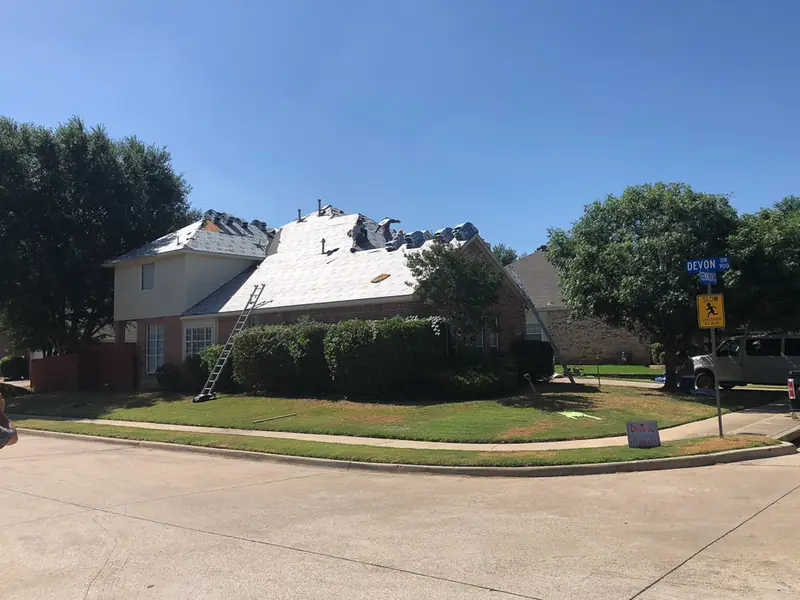 Dimensional Pro Construction crew working on a roof replacement
