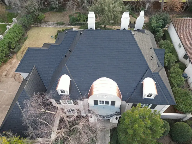 Aerial view of a new roof installed by Dimensional Pro Construction