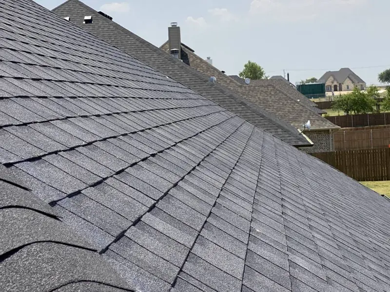 Close-up of new shingles installed by Dimensional Pro Construction