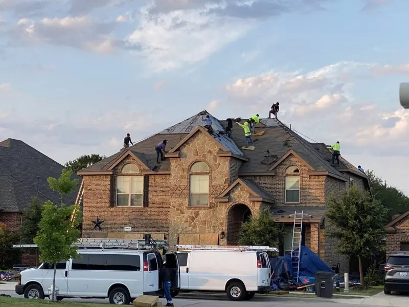 Dimensional Pro Construction crew working on a roof replacement