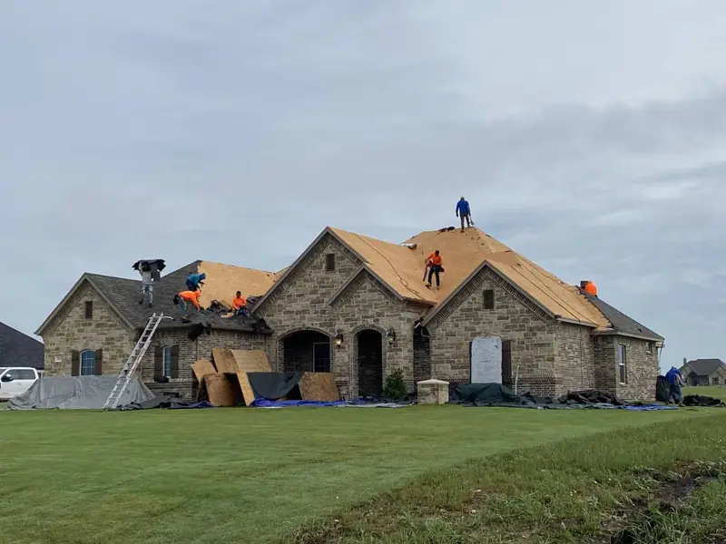 Dimensional Pro Construction crew working on a roof replacement