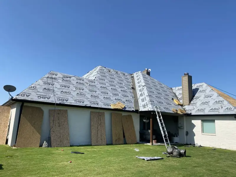 Dimensional Pro Construction crew working on a roof replacement