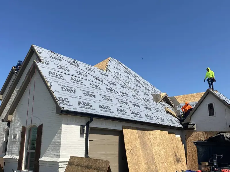 Dimensional Pro Construction crew working on a roof replacement