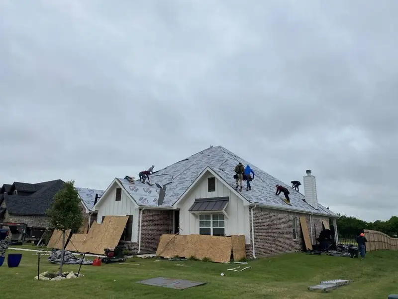 Dimensional Pro Construction crew working on a roof replacement
