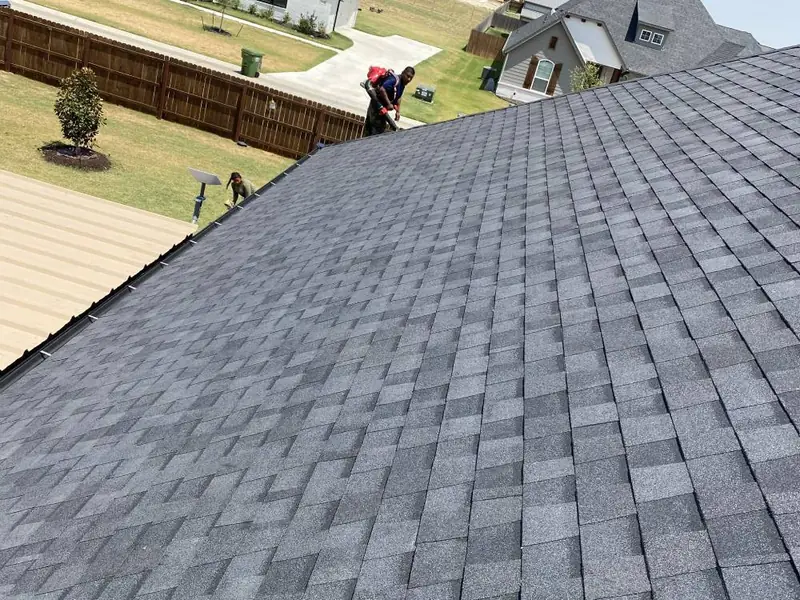 Close-up of new shingles installed by Dimensional Pro Construction