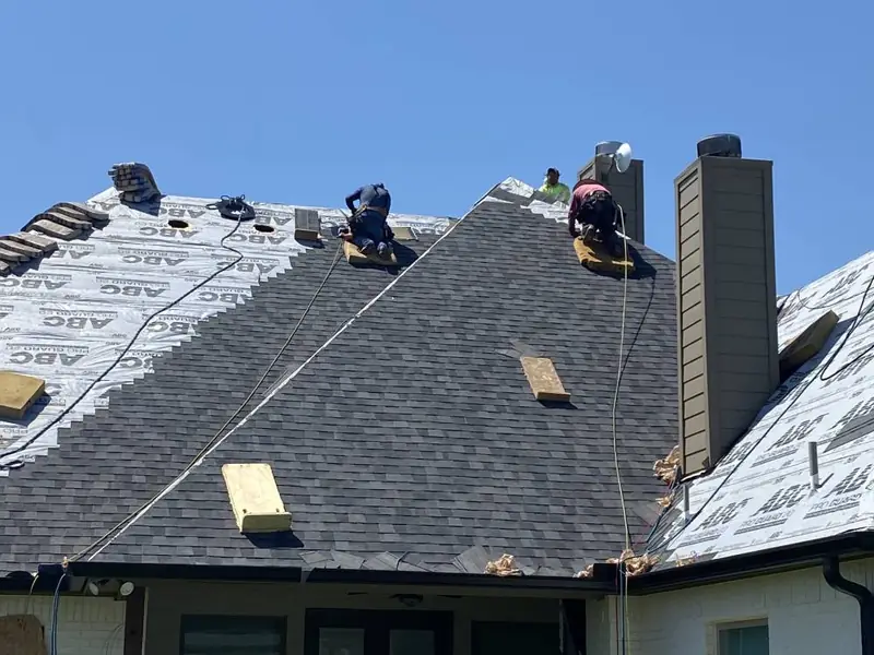 Dimensional Pro Construction crew working on a roof replacement