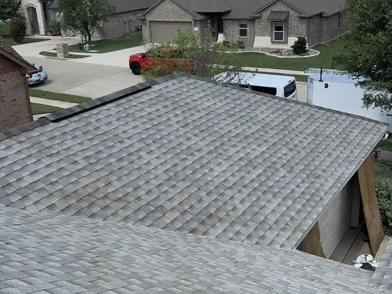 Close-up of new shingles installed by Dimensional Pro Construction