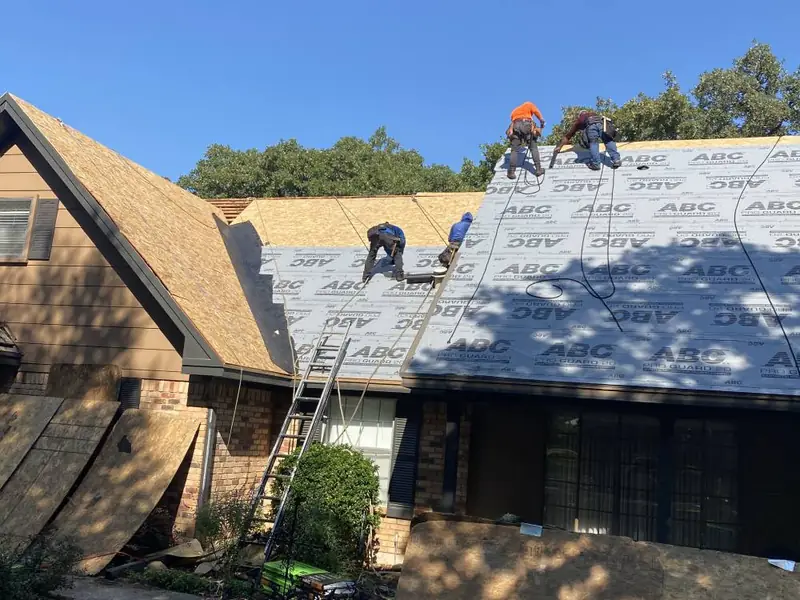 Dimensional Pro Construction crew working on a roof replacement