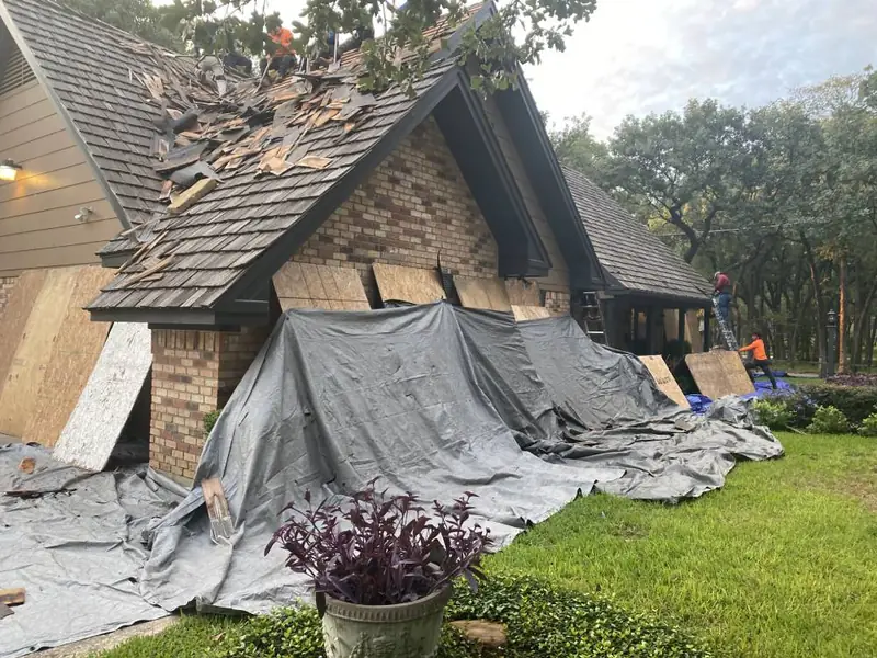 Dimensional Pro Construction crew working on a roof replacement