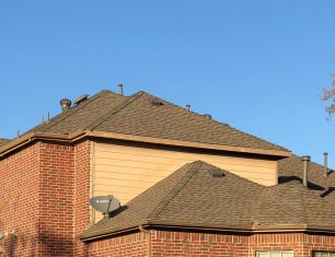 Brick home with asphalt shingle roof