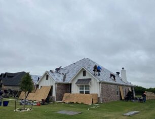Workers redoing a whole roof