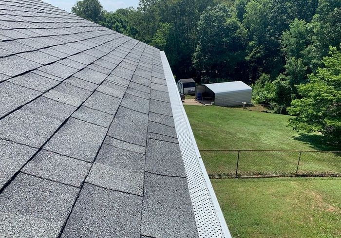 Picture of clean asphalt shingle roof and gutter